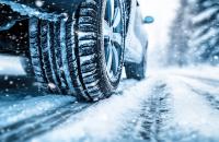 Car in the winter driving on snowy road