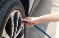 Person filling up their tire