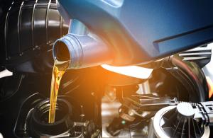 oil being poured into car change with light gradient overlay